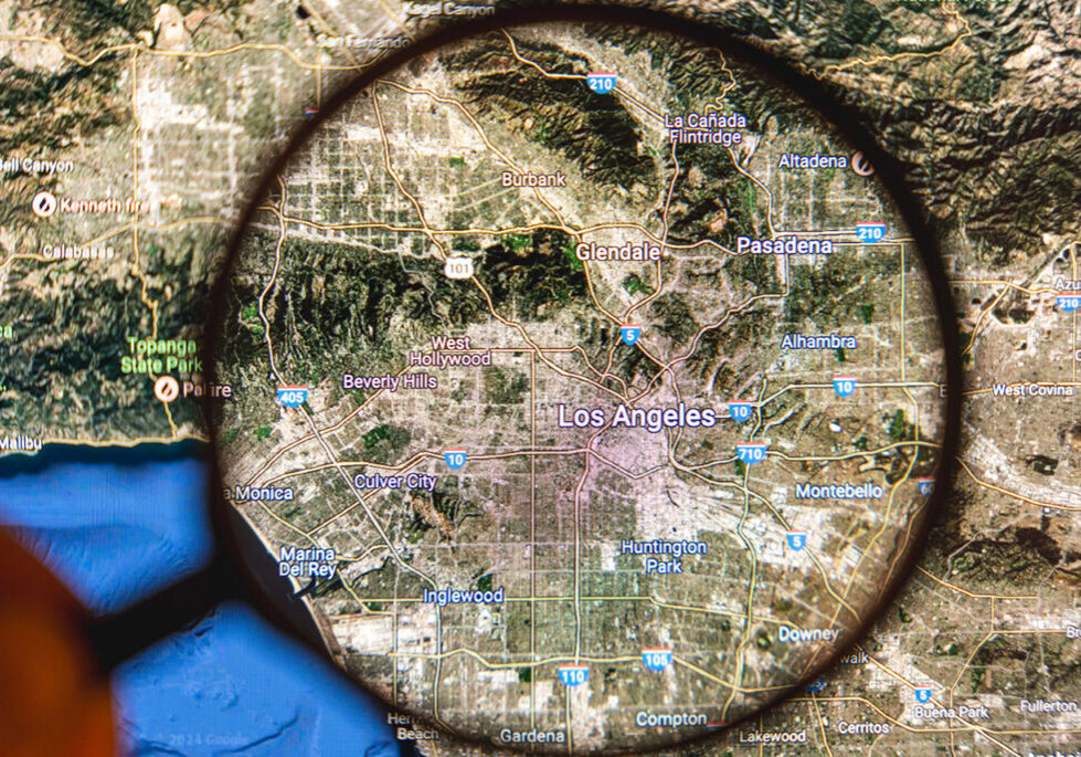 Online map of Los Angeles with a magnifying glass held above it