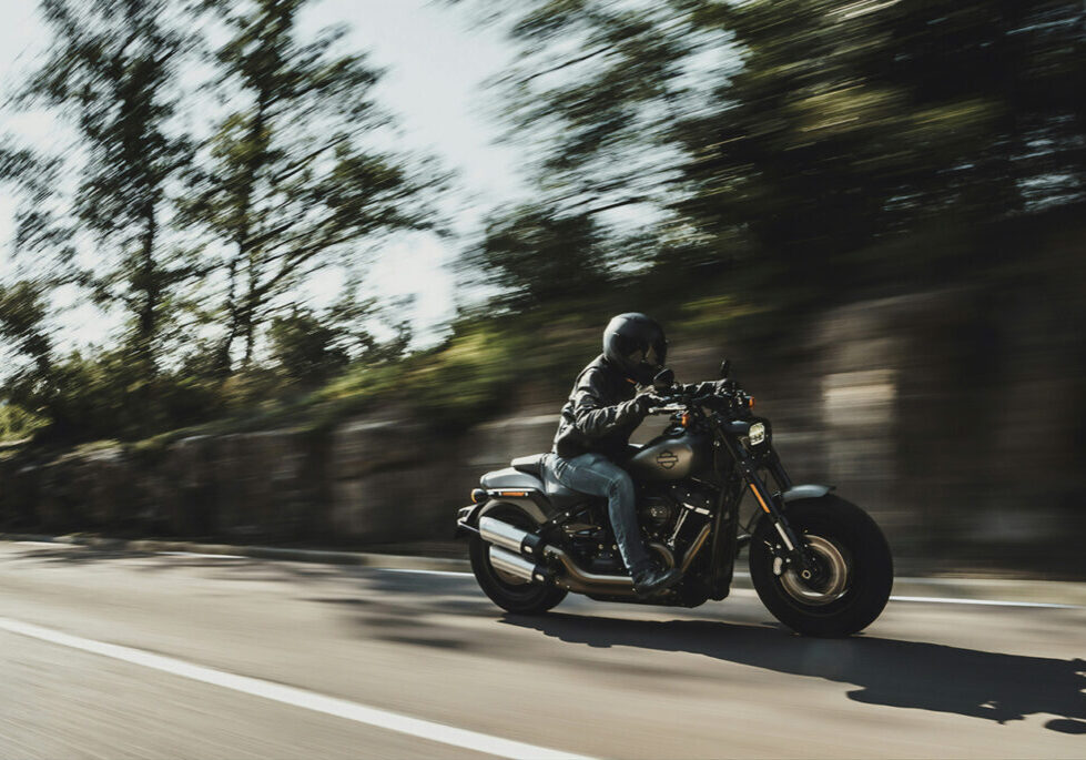 Man riding motorcycle with helmet and jacket